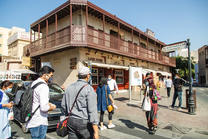 Dubai Souks, Food & Culture Walking Tour - Textile Souk and freshly fried Indian snacks