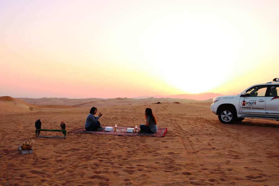 Dubai: Sunrise Desert Jeep Safari with Wildlife Experience - Sandboarding down the soft slopes