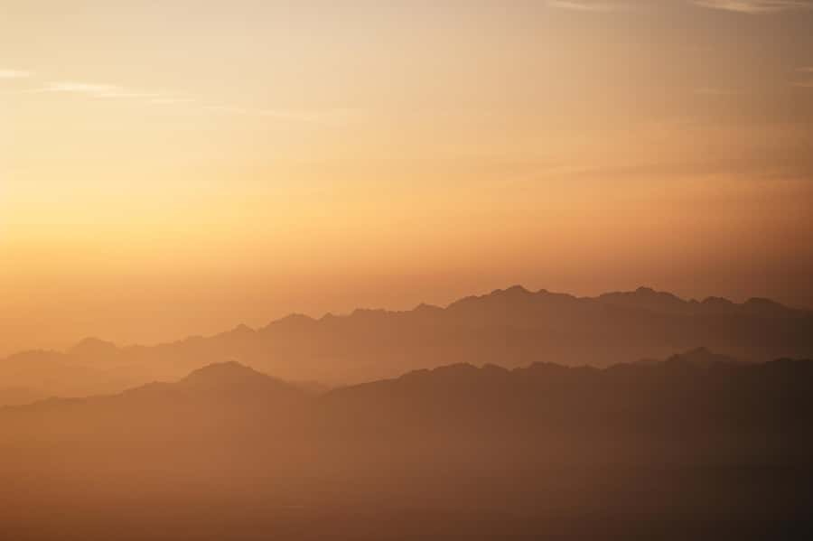 Dubai: Sunrise Hot Air Balloon Tour Over the Desert - Sunrise, Dunes, and Distant Mountains