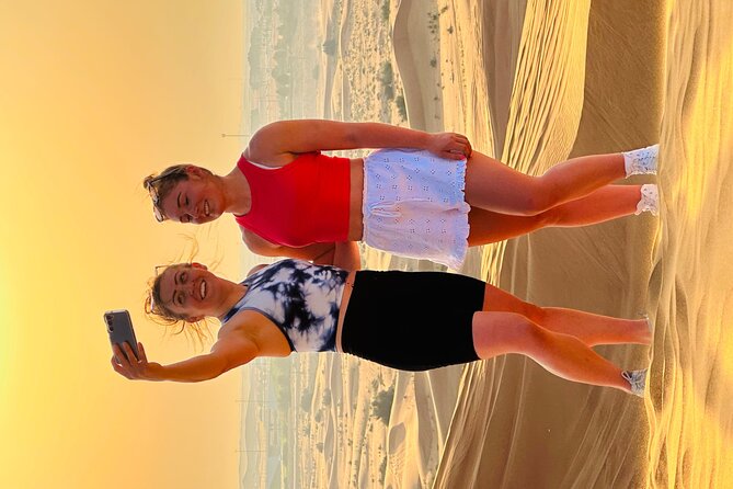 Dubai Sunset Red Dune Desert Safari, Sandboarding and Camel Ride - Sunset photos are the calmest part of the trip