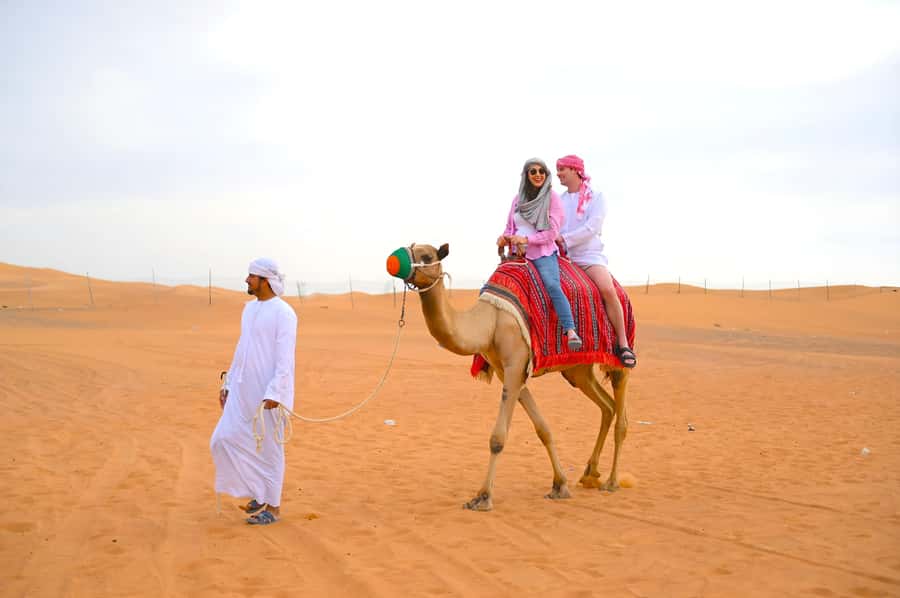 Dubai: Tour with BBQ Dinner, Camel Ride, & Traditional Show - The short camel ride and falcon photo stop