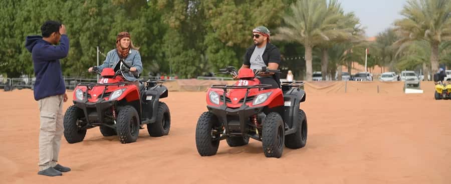 Dubai: Tour with BBQ Dinner, Camel Ride, & Traditional Show - Al Aweer camp: sweets, coffee, and henna