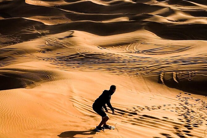 Dubai Unique Sunset Combo: 4WD and Quad Bike Red Dunes Safari - Sandboarding, camel riding, and the sunset stop