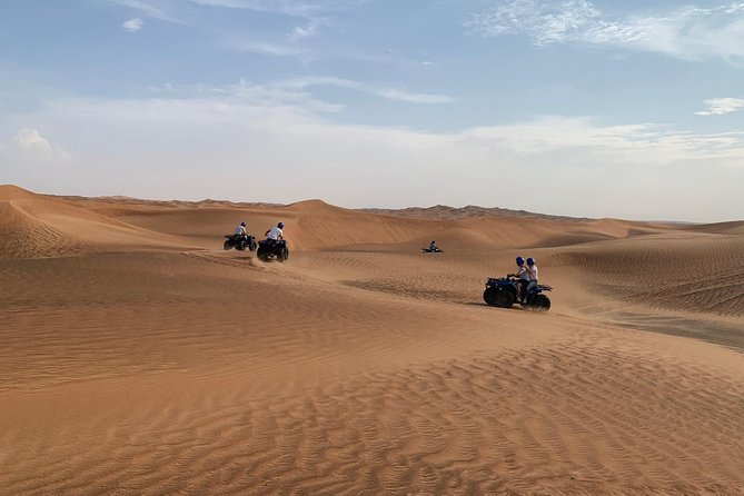 Dubai: Unique SUNSET Quad Bike Red Dunes Safari - The quad-bike hour is the main event