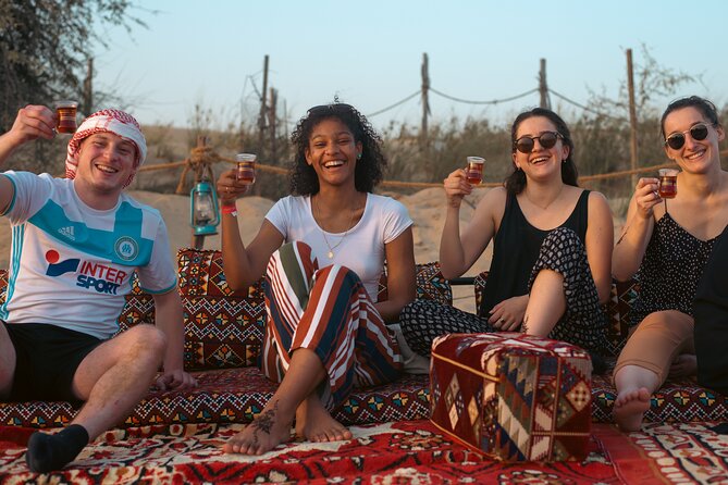 Evening Camel Caravan, Bedouin Dinner with Al Marmoom Oasis - Traditional dress and falcon photographs