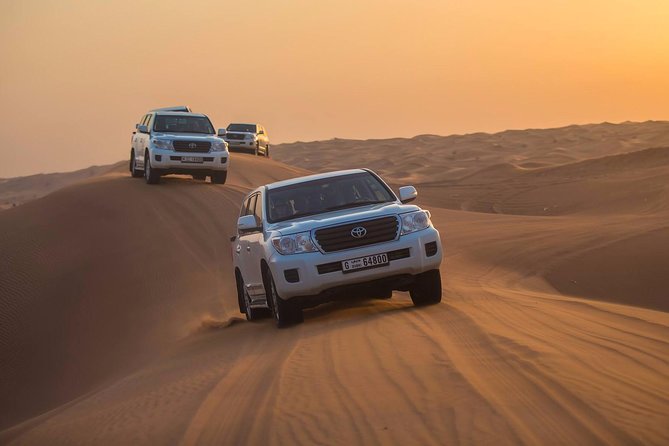 Evening Desert Adventure: Quad Biking, Sandboarding & Camel Ride - Arabic coffee, dates, and the Desert Premium Camp