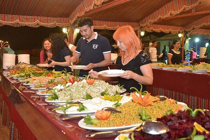 Evening Desert Adventure: Quad Biking, Sandboarding & Camel Ride - BBQ dinner under the stars