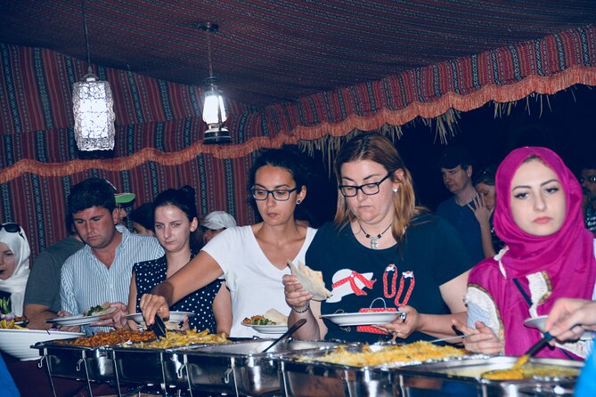 Evening Desert Safari Abu Dhabi with Hot BBQ Dinner - An Arabian-style camp after dark