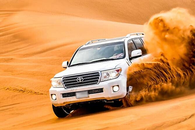 Evening Desert Safari Dubai with Camel Riding & BBQ Buffet Dinner - Dune bashing across the Lahbab sand