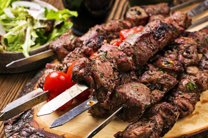 Evening Desert Safari in Dubai, Sandboard & BBQ Dinner - Fire, Tanoura, and belly-dance shows