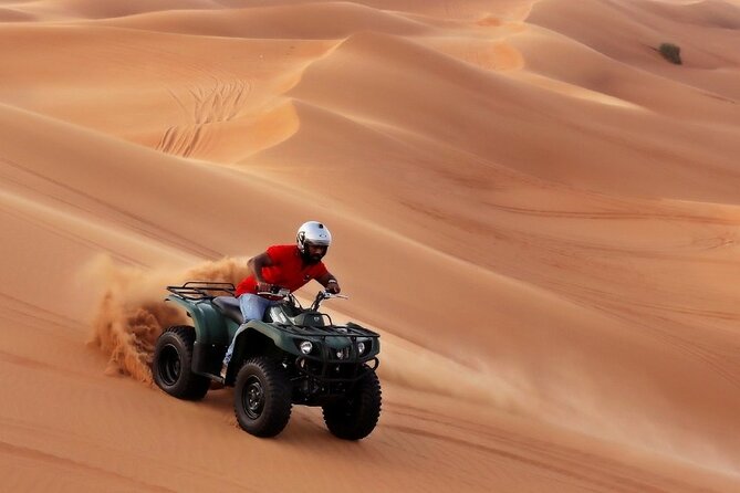 Evening Desert Safari with ATV Quad Bike Dune Bashing BBQ Dinner - ATV riding across the golden sand