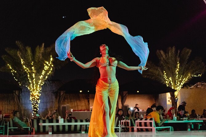 Experience Red Dune Safari Shows, Camels, BBQ & ATV Bike in Dubai - A short camel ride and a taste of camp life