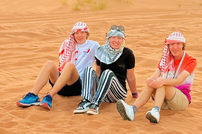 Experience Red Dune Safari Shows, Camels, BBQ & ATV Bike in Dubai - BBQ dinner with belly dance, fire, and Tanoura