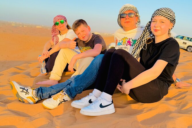 Experience Red Dune Safari Shows, Camels, BBQ & ATV Bike in Dubai - Sunset photos with help from the guide