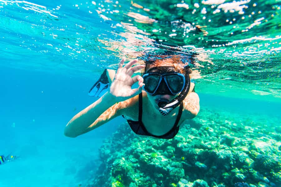 From Dubai: Snorkeling Trip to Dibba Al-Fujairah - Boarding the boat and reaching the reefs