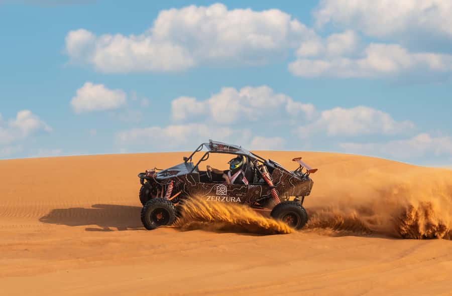 From Dubai: Zerzura Buggy Experience + Private Dinner - Taking the wheel for the dune buggy run