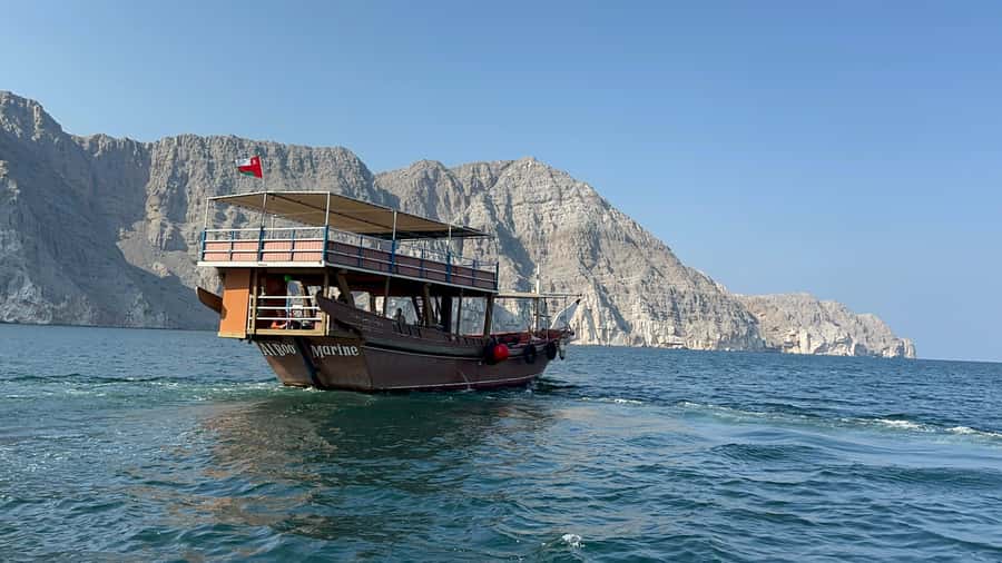 From Ras al Khaimah: Musandam Khasab Day Trip with Transfer - Boarding the traditional dhow in Khasab