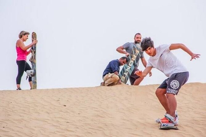 Full-Day Desert Safari with Dune Buggy Ride in Dubai - Sandboarding, camels, and henna at camp
