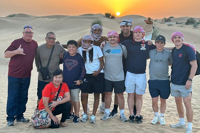 Guided Desert Safari with Dinner and Quad Biking in Dubai - Camel riding and sandboarding at sunset