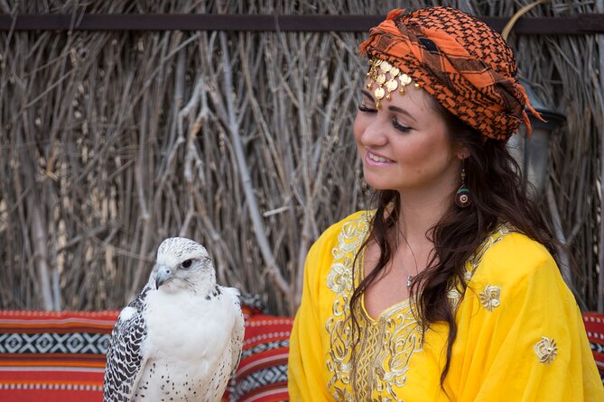 High Red Dunes with Camel Ride, Sandboarding, Falcon Show and VIP BBQ Dinner - BBQ dinner with VIP seating and live entertainment