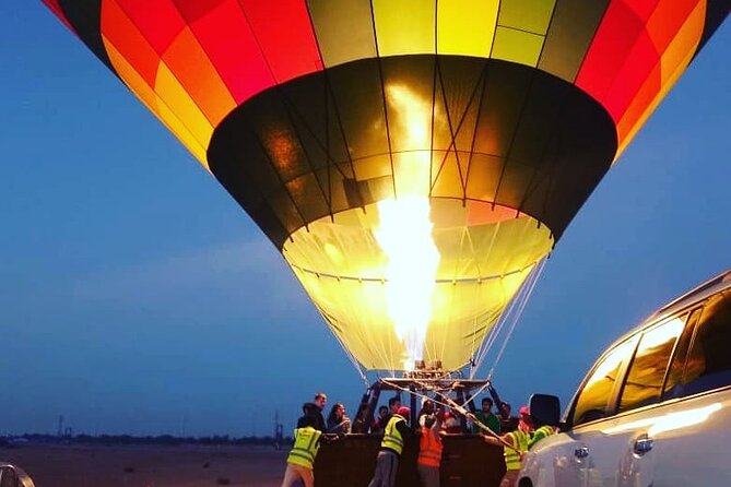 Hot Air Balloon Ride Over Dubai Desert inlcuding Transfers - Watching the balloon inflate in the dark