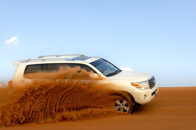 Morning Desert Safari, Quad Bike, Sandboard and Camel Ride - Dune bashing with an experienced desert driver