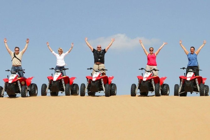 Morning Desert Safari With Quad Bike - Sandboarding looks easy until the climb back up