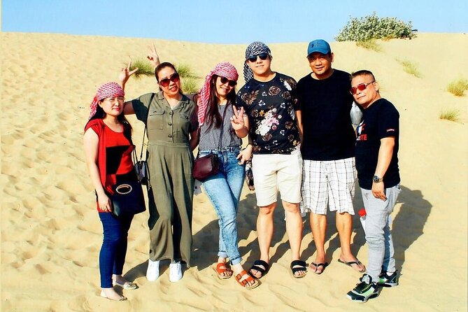 Morning Dubai desert safari - camel rides, quad bikes, dune buggies,dune bashing - Sandboarding adds a quieter kind of fun