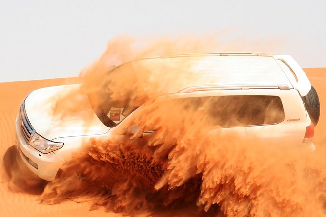 Morning Dubai Desert Safari with Sand boarding and Camel Ride - Dune bashing across the red dunes