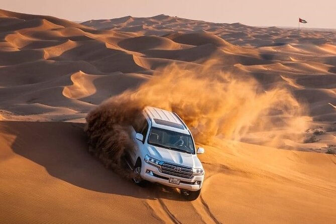 Morning Red Dunes Desert by Quad Bike, Dune Bashing, Camel Ride & Sandboarding - Sandboarding turns the dunes into a playground