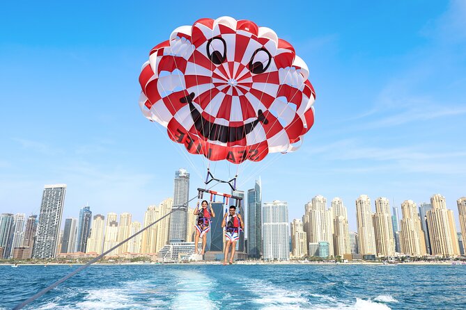 Parasailing in Dubai with Palm Jumeirah and JBR Beach views - Photos, videos, and the small extras