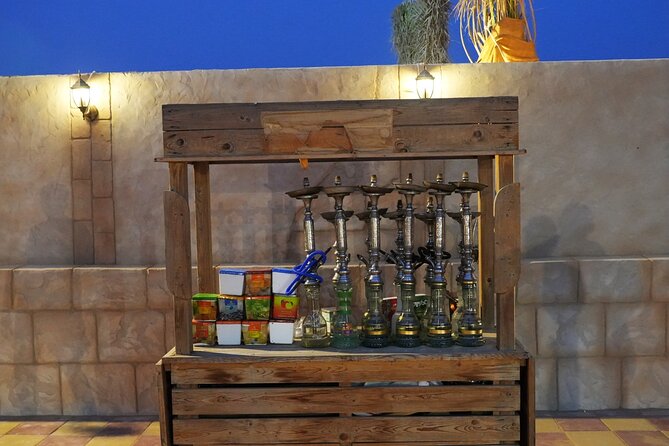 Premium Deluxe Dubai Safari with Camel Ride, Sandboard & BBQ - The evening shows under the desert sky