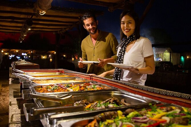Premium Desert Safari Dubai : Dune Bashing, Camel Ride with BBQ - BBQ dinner and the evening show