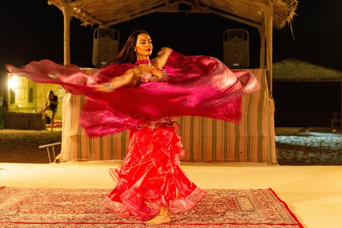 Premium Dubai Desert Safari with BBQ Dinner in the Red Dunes - Sandboarding on the dune slopes