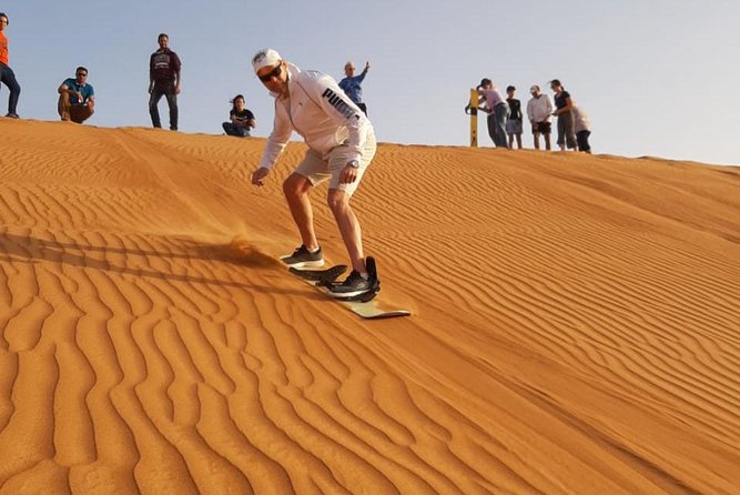 Private Desert Safari Red Dune with BBQ, Sand Boarding and Camel Ride - A brief camel ride and a look at the camel farm