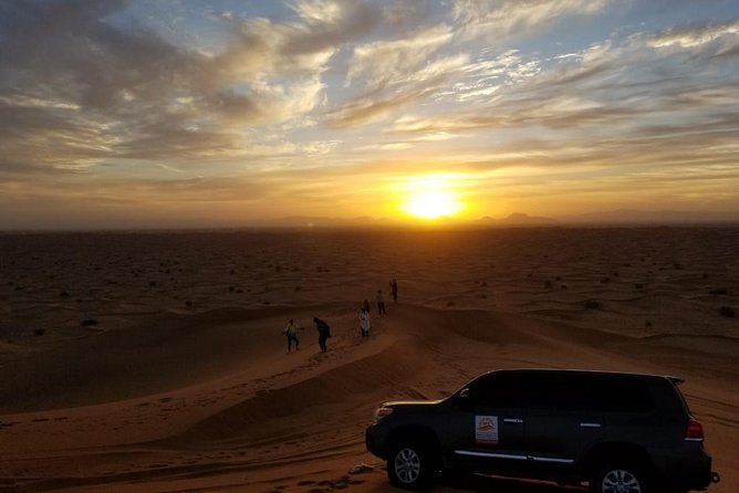 Private Evening Red Sand Desert Safari with BBQ Dinner - Arabian coffee, dates, and henna at camp