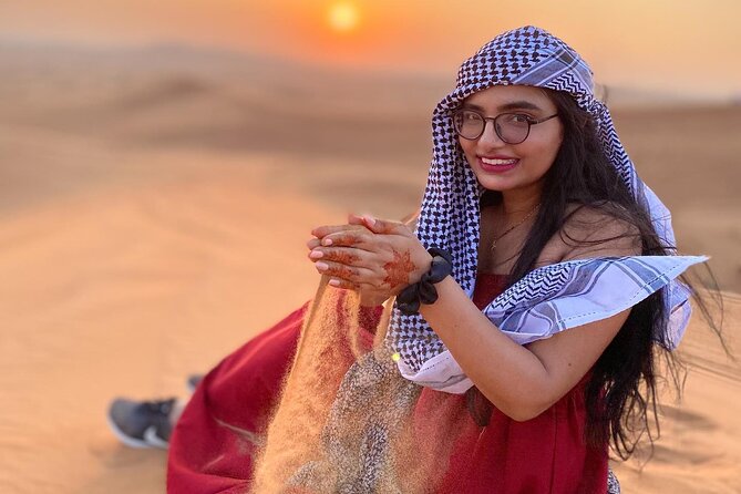 Red Dunes Desert Safari 4x4 Pickup & Drop, Camel Ride BBQ & Shows - Camel riding and sandboarding at camp