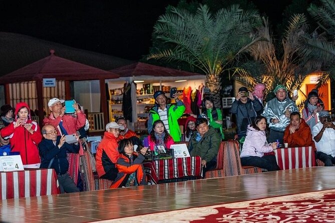 Red Dunes Desert Safari with 4x4 Pick up & Drop, Camel ride, BBQ and Live shows - BBQ dinner and evening entertainment