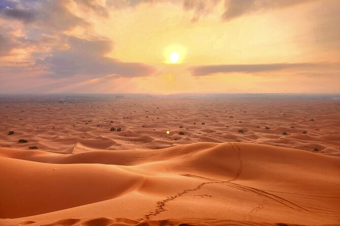 Shared Desert Safari Tour Dubai with Dinner Included - Sandboarding on soft desert slopes