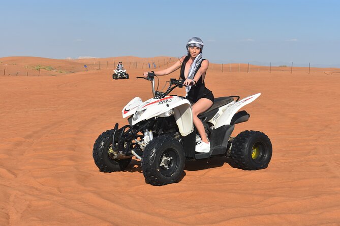 Sunset Desert Safari Quad bike Camel ride Sand Board & BBQ Dinner - From Dubai streets to the red dunes of Lahbab