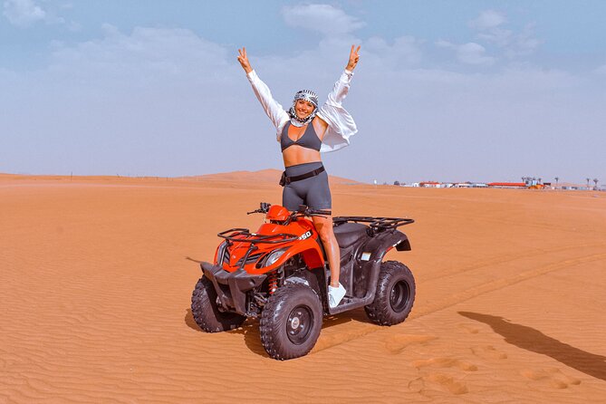 Sunset Desert Safari Quad bike Camel ride Sand Board & BBQ Dinner - Dune bashing and sunset photos