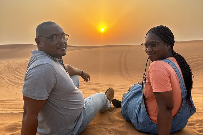Sunset Desert safari with Camel Ride Sand Board & BBQ Dinner - Timing, transport, and group size